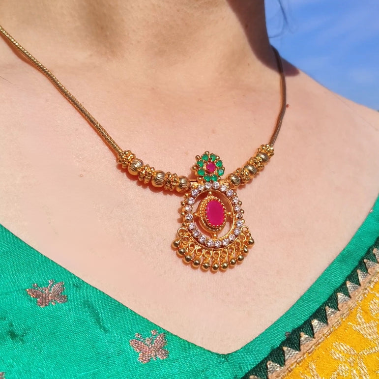 Traditional Gold-Plated Necklace with White and Emerald Stones – Elegant Festive Design