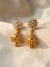 Floral Gold-Plated Jhumka Earrings with Crystal Stones
